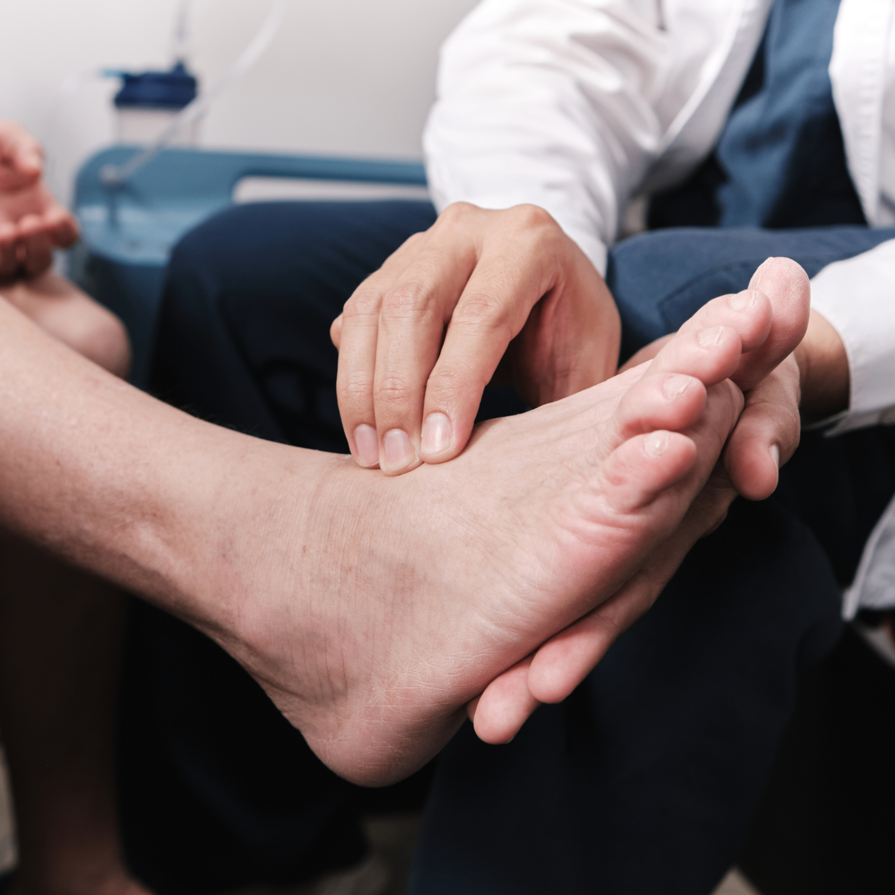 Podiatrist examining a patient's foot during a neuropathy evaluation